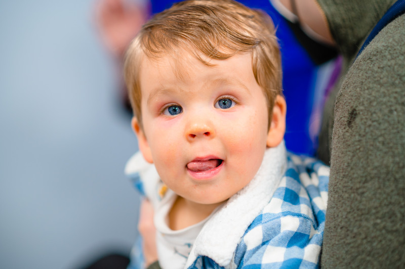 a boy with his tongue hanging out